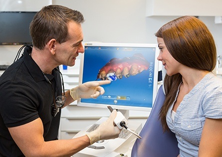 Patient and dentist looking at digital smile design