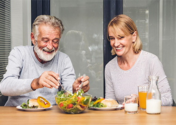 a couple eating healthy for dental implant care in North Dallas