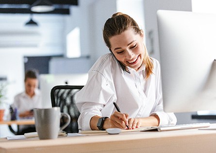 Woman smiling while working in office