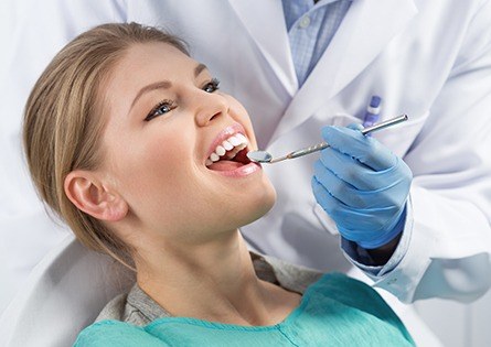 Woman receiving dental exam