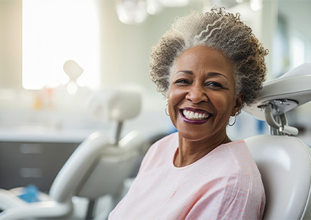 Senior woman smiling in the dental chair
