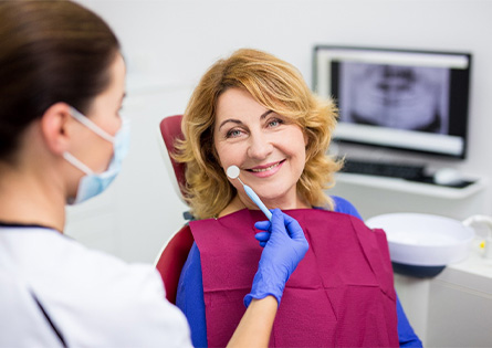 Woman smiling at her dentist