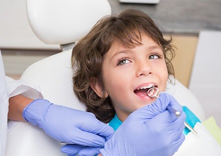 Child receiving dental exam