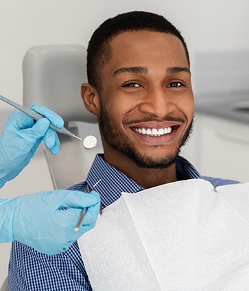 Patient in Dallas smiling after a dental checkup