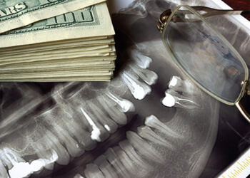 X ray next to a pile of money
