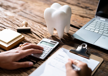 a dental patient filling out a dental insurance form