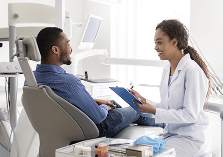 Dallas dentist and patient discussing dental crowns 