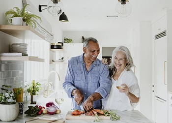 elderly couple cooking in their kitchen