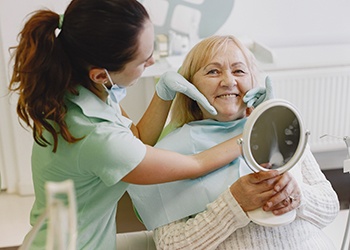 Patient in Dallas smiling with dentures