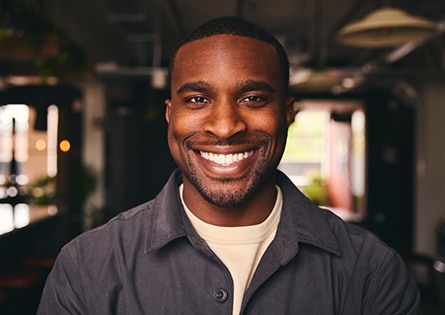 Man with beard smiling with tooth-colored fillings