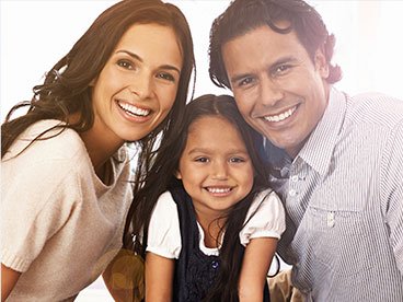 Smiling mother father and child outdoors