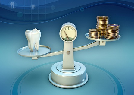 Tooth and coins on balance scale