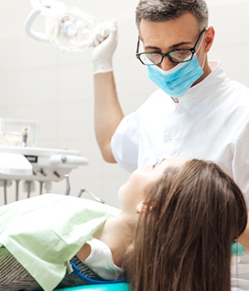 MetLife dentist preparing to check a female patient’s teeth