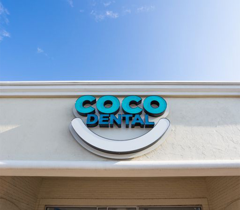 Coco Dental sign on the outside of dental office in North Dallas