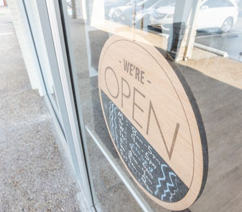 Sign on a door reading were open