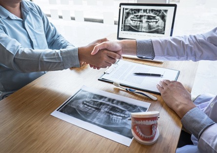 patient and dentist agreeing to full mouth reconstruction plan  