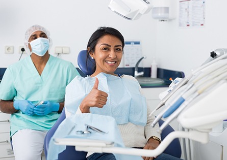 A young woman who received dental implant salvage