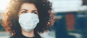 woman correctly wearing a face mask during the COVID-19 pandemic 