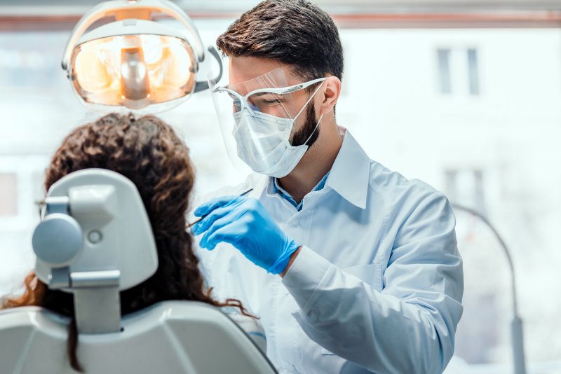 Dentist conducting dental procedure