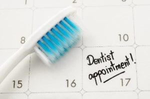 Dental appointment and toothbrush on calendar