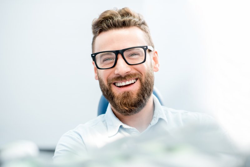 person smiling after full mouth reconstruction