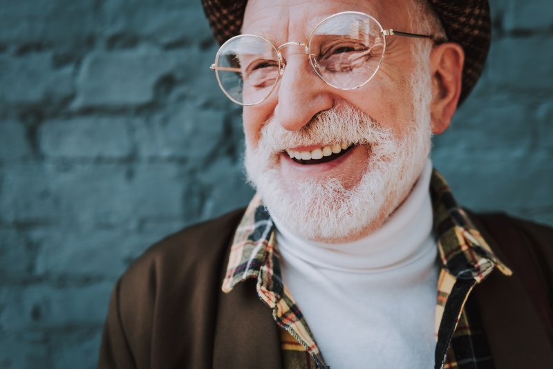 smiling older woman wearing dentures