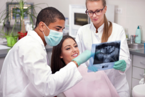 a patient attending their dental implant consultation