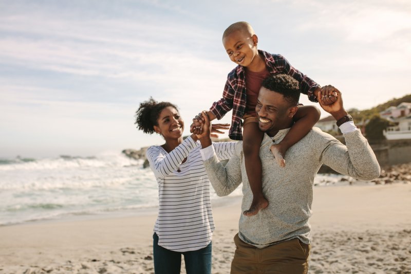 family playing on the summer beach