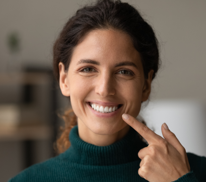 Woman pointing at smile
